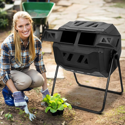 43 Gallon Black Compost Tumbler Dual Rotating Outdoor Garden Bin For Easy Batch Composting In The Backyard Durable Iron And PP Construction Easy To Turn With Dual Handles And A Large Door For Scraps And Kitchen Waste next to a gardener