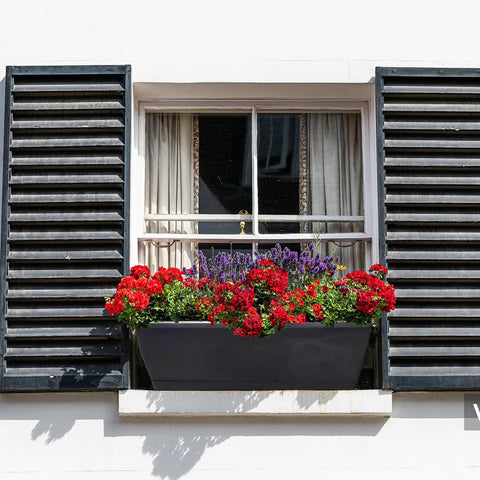 Window Box Planter Set 10 Pack 17 Inch Rectangular Plastic Flower Boxes With Trays For Outdoor And Indoor Plants installed on a window sill