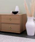 Top Notch Vintage Peg And Ring Cabinet Handles on wooden cabinet with decorative items and vase in a modern setting.