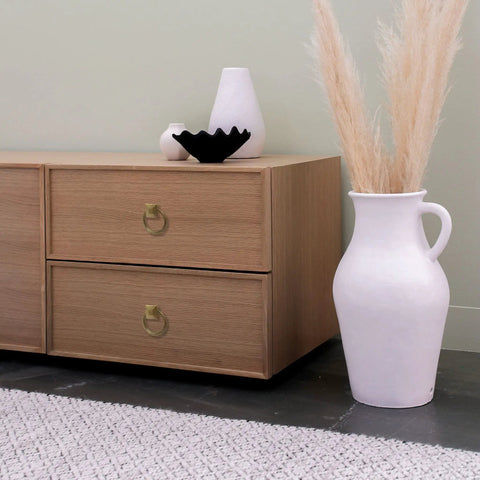 Top Notch Vintage Peg And Ring Cabinet Handles on wooden cabinet with decorative items and vase in a modern setting.