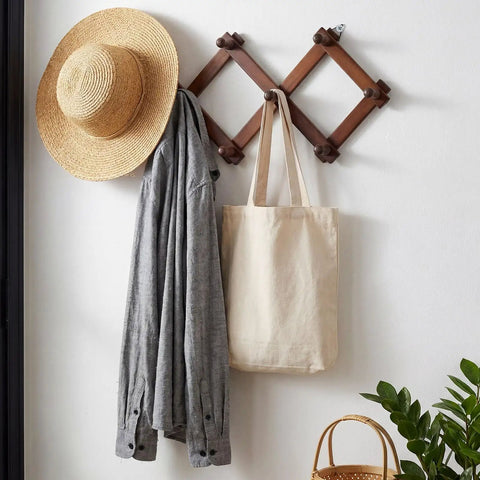 Expandable Wall Mounted Hat Rack With 10 Hooks, Space Saving Coat And Mug Organizer in use with hat, coat, and bag