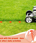 20 Pack 5 Inch Low Profile Survey Markers High Visibility Orange Yard Stakes for lawns with lawnmower close by