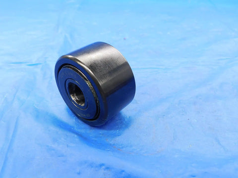Rock Solid Cam Yoke Roller Bearing With Lubri Disc Seal 1 3/4 Inch Outer Diameter and Half Inch Inner Bore on blue background.