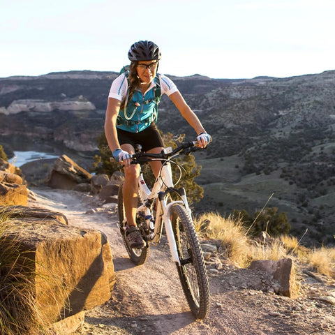 Cyclist riding mountain bike on trail, equipped with Beefy 26 Inch Bike Tubes 26x2.125 To 2.40 With AV32mm Schrader Valve