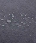 Water droplets on the gray nonwoven fabric cover of Heavy Hitter Portable Closet Wardrobe Organizer.