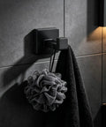 Solid Double Hook Wall Mount For Small Bathrooms Sleek Silver Finish Space Saving Towel Rack With Heavy Duty Grip Easy Wipe Design That Totally Flips Your Messy Vibe Today with black towel and bath sponge.
