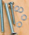 100 Piece Stainless Steel Spring Lock Washers 1/4 Inch Split Lock Washers Heavy Duty Hardware Set for Bolts and Screws on wood surface.