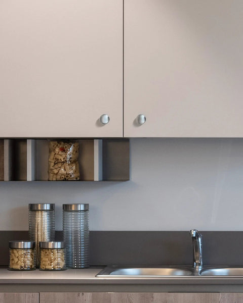 Modern kitchen cabinet featuring Premium Brushed Nickel Cabinet Drawer Knobs 30 Piece Set with sleek design.