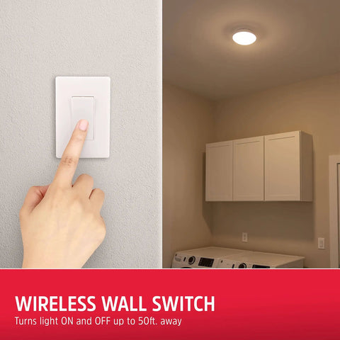 Hand pressing wireless wall switch with cordless LED ceiling light installed in a laundry room for remote control convenience.
