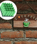 Green Plastic Drywall Anchor Kit With Self Tapping Screws for gypsum shown on brick wall next to coffee art sign