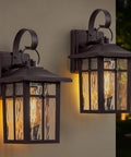 Two Pack Brown Dusk To Dawn Outdoor Wall Lights Built Tough With Cross Grid Panels And Warm Water Ripple Glass Porch Lanterns.