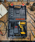 Heavy Duty Cordless Power Drill and 21V Electric Screwdriver Set With Adjustable Torque, accessories and case on a workbench.
