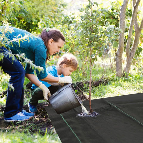 Person and child using Heavy Duty Weed Barrier Landscape Fabric 3ft x 10ft Ground Cover For Outdoor Gardens And Flower Beds Weed Block Mat