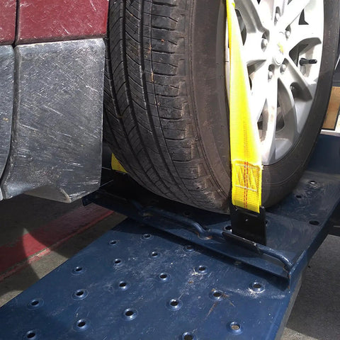 Heavy Duty Tow Dolly Basket Straps Two Pack With Flat Steel Hooks For 15 To 19 Inch Car Tires securing a tire on a dolly.
