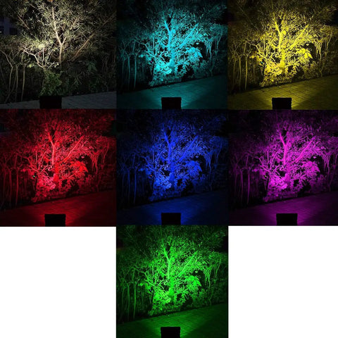 JUDYSSY Led Flood Lights Outdoor Solar Lights showcasing vibrant colors illuminating trees in a garden setting.