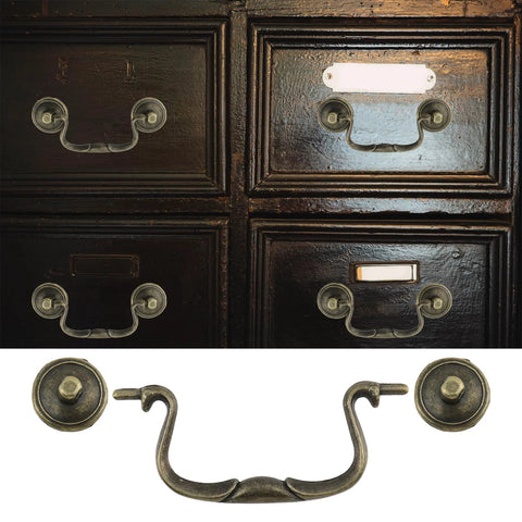 Set Of 6 Antique Bail Handle Drop Pulls With Screws In Vintage Bronze, shown on dark cabinet drawers, 3.3 inch centers