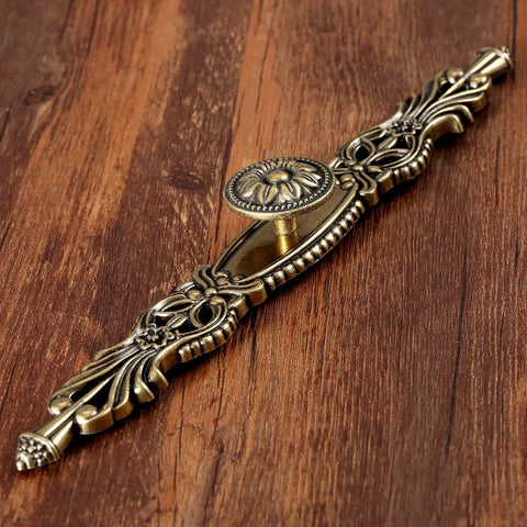 Vintage Antique Bronze Cabinet Pulls 10.2 Inch 5 Piece Set Sweet Hardware For Rad Kitchen Reno And Bathroom Refresh Top Tier Three Hole Mounting Drawers Handles Hella Stylish Glowy Finish To Elevate Your Home Game Fast, detailed handle on wood.