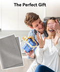 Man surprising woman with gift, showing Ultra Soft Microfiber Cleaning Cloths 3 Pack For Eyeglasses, Phones, Screens, Lenses And Delicate Electronics