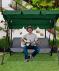 Man sitting on a swing under Outdoor Swing Canopy Replacement UV30 Plus 180Gsm Green Canopy Top 76x44 Inches with guitar.