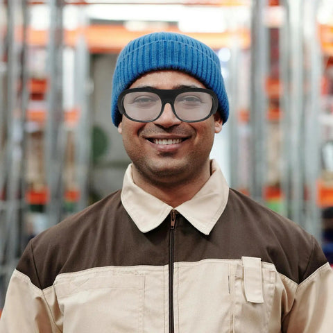 Badcas Steampunk Welding Goggles with Flip up Lenses for Spark and Debris Defense 6 Pack Bundle worn by smiling man in blue beanie.