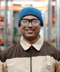 Professional Grade Welding Safety Glasses With Flip Up Lens For Argon Arc And Metalworking 6 Pack Tough As Nails Eye Protection worn by smiling worker