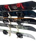 Premium Wall Rack Mount For Ski Snowboard And Longboard Storage Featuring Adjustable Baltic Birch Arms Heavy Duty Gear Holder Holds Up To One Hundred Twenty Pounds with multiple snowboards displayed.