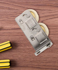 Heavy Duty Stainless Steel Track Roller That Glides Like Butter For Sliding Door Replacement Wheel And Window Pulley Hardware Kit Built Tough Premium Nylon Core Bearing 22mm Size on wood background with tools.