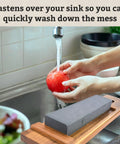 Sink Mounted Whetstone Holder For Easy Knife Sharpening No Mess Over The Sink, Warm Acacia Wood Design, holding tomato