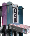 Big Boy Ski Rack Wall Mount For Garage Storage Keeps Six Pairs Of Skis And Snowboards Locked Down With Easy Snap Together Hooks Supports Up To Seventy Five Pounds In Sleek Black with multiple skis and packaging.