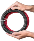 Hands holding Beefy 6 Gauge Premium Extra Flexible Welding Cable 600 Volt Combo Pack, 15 Feet Each Black And Red, Made In USA