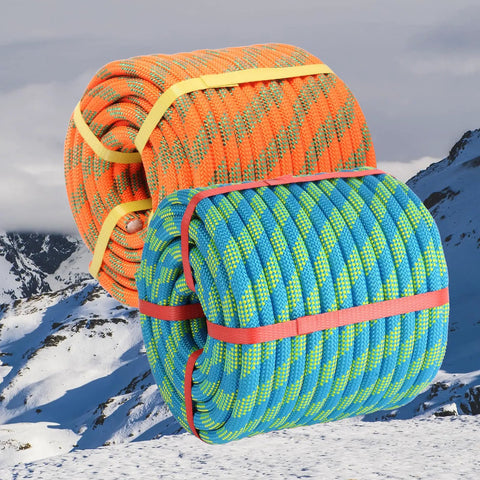 Half Inch By Hundred Feet Arborist Tree Climbing Rope Forty Eight Strand Polyester Static Bull Line in orange and blue coils.