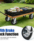 10 Inch Heavy Duty Pneumatic Caster Wheels With Secure Brake Set Of Four on a wagon loaded with containers, grass background.