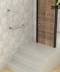 Brushed Nickel L Shaped Grab Bar 16 Inch Rock Solid Wall Mount Safety Handle on tiled wall by steps for bathroom safety.