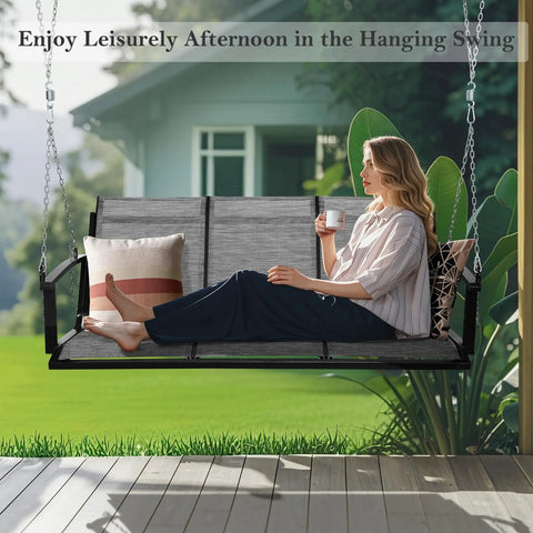 Woman relaxing on Textilene Three Seat Hanging Swing for Backyard Chill Sessions with 5.2 ft patio bench in garden