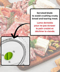 Close-up of the serrated blade of the Top Notch Manual Rotary Deli Slicer With A Six Point Five Inch Serrated Blade And Dead Simple Thickness Tweaks Plus Bonus Two In One Peeler For Hassle Free Carving Of Meats Cheeses Bread And Big Loaves.