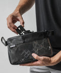 Person holding Small Black Electronics And Camera Accessories Bag With TPU Water Resistant Layer, Cable Organizer Pouch