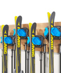Heavy Duty Wall Mounted Ski And Snowboard Rack For Garage Keeps Gear Crash Proof Featuring Soft Rubber Holders That Lock Boards Rock Solid And Super Sweet Storage Setup Blue 4 Pack with skis and poles secured.