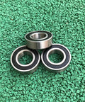 20 Pack Stainless Steel 6004-2RS Deep Groove Ball Bearings 20X42X12MM 440C Rust Resistant Sealed Design on green surface