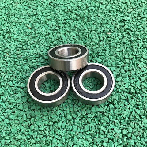 20 Pack Stainless Steel 6004-2RS Deep Groove Ball Bearings 20X42X12MM 440C Rust Resistant Sealed Design on green surface
