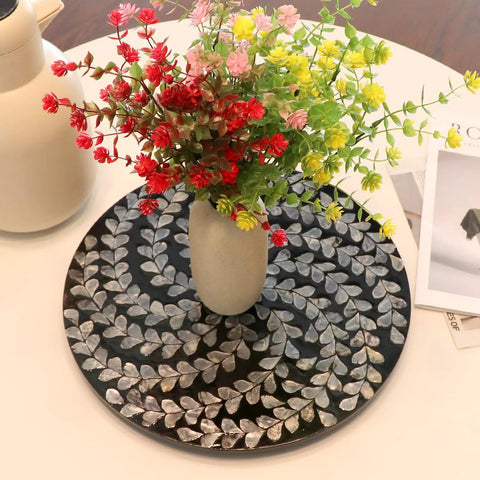 Hecka Smooth 13.4 Inch Round Lazy Susan Countertop Turnable Tray Featuring Mother Of Pearl Center And Black Wicker Boho Pattern For Kitchen Dining Or Bar Spaces with flowers in vase.