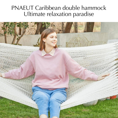 Two Person Rope Hammock With Hardwood Spreader Bar For Indoor Outdoor Use, Handwoven Caribbean Style, Cream Color with person sitting