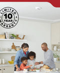 Family cooking together in a kitchen with Two Pack Smoke Detector AA Battery Powered Model 20SDR visible on ceiling.