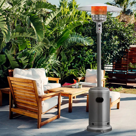 Heavy Duty 50,000 BTU Propane Patio Heater for Outdoors in a backyard with wooden chairs and greenery