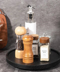 Premium Wood Lazy Susan Turntable Functions As Slick Kitchen Game Changer With Smooth Swivel Glide Waterproof 11 Inch Black Round Serving Tray with spices.