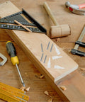Heavy Duty Wall Anchors Set With Screws for Drywall and Concrete, tools on a wooden surface