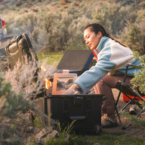 Person using Trail 80 Waterproof Storage Box with Wheels, 79L Outdoor Gear Case for Camping, Fishing, and Hunting, black color