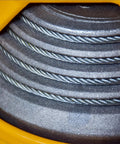 Retractable Tool Balancer And Hanging Tool Holder For Auto Molds And Welding Lines No Power Needed Heavy Duty Powder Coated Rope Supports 80 To 100 Kg Capacity For Robot Arm Work And Assembly Lines close-up of coiled steel rope