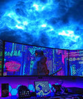 Thundercloud LED Cloud Light With 16 Feet Cord creating multicolor RGB atmosphere lamp effect in gaming room with monitors