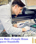 Top Shelf 280 Pcs M2.5 Motherboard Standoffs And Premium Brass Screws Kit For Desktop Builds And Electronics used by technician inspecting standoffs.
