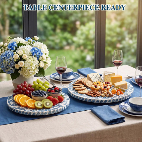 Two Pack Mother Of Pearl Lazy Susan Turntable Set With Blue Wicker 12 And 13 Inch Rotating Trays with fruits and cheeses on a table.